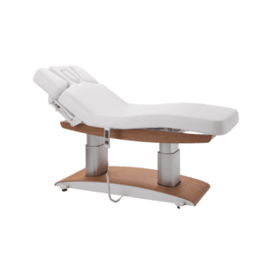 Uma espreguiçadeira elétrica sofisticada, ideal para clínicas estéticas, spas e centros de bem-estar. Com um design moderno e elegante, possui acabamento em madeira, estofamento branco de alta qualidade e iluminação LED na base. 